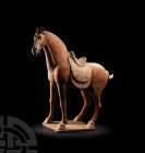 Very Large Chinese Tang Saddled Horse Tang Dynasty, 618-907 A.D. A large ceramic horse modelled in the round with naturalistic anatomical detailing, s...