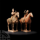 Chinese Tang Hunter Pair on Horseback Tang Dynasty, 618-907 A.D. A pair of ceramic mounted hunters, each modelled with semi-naturalistic anatomical de...