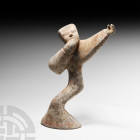 Chinese Han Dynasty Archer Han Dynasty, 206 B.C.-220 A.D. An earthenware archer figure modelled in a dynamic standing posture drawing his bow (now abs...