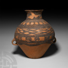 Chinese Painted Neolithic Jar 3rd millennium B.C. A ceramic jar with piriform body, bulbous neck, everted rim and two integral loop handles below the ...