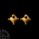 Vietnamese Gold Oc Eo Earring Pair 9th century A.D. A matching pair of gold earrings, each composed of a lozenge-shaped, lentoid-section body with thr...