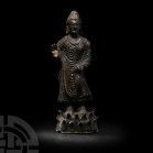 Gandharan Fearless Buddha Shakyamuni 2nd-3rd century A.D. or later. A bronze figure of Buddha Sakyamuni modelled in the round standing bare-footed on ...