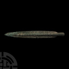 Large South Italic Socketted Spearhead 1700-1350 B.C. A bronze spearhead composed of an elongated leaf-shaped blade, tapering round-section socket lea...