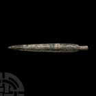 Large South Italic Socketted Spearhead Circa 18th-early 14th century B.C. A bronze spearhead composed of an elongated leaf-shaped blade with tapering ...