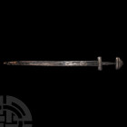 Viking Sword with Silver Inlaid Hilt Early 9th century A.D. A Viking period sword comprising: a 9th century high-status silver-covered lobed pommel an...
