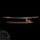 Japanese Katana Sword with Scabbard Koto Period, before 1595 A.D. and later. A katana with curved single edged blade showing straight hamon edge-patte...
