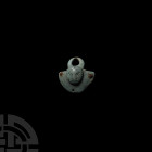 Iron Age Figural Bowl Mount with Horns 1st century B.C.-1st century A.D. A bronze bowl mount comprising a D-shaped plaque with curved outer face and r...