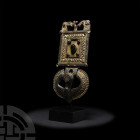 Gothic Gilded and Jewelled Buckle Circa 6th century A.D. A bronze gilt buckle composed of a rectangular plate with circular cell to each outer and inn...