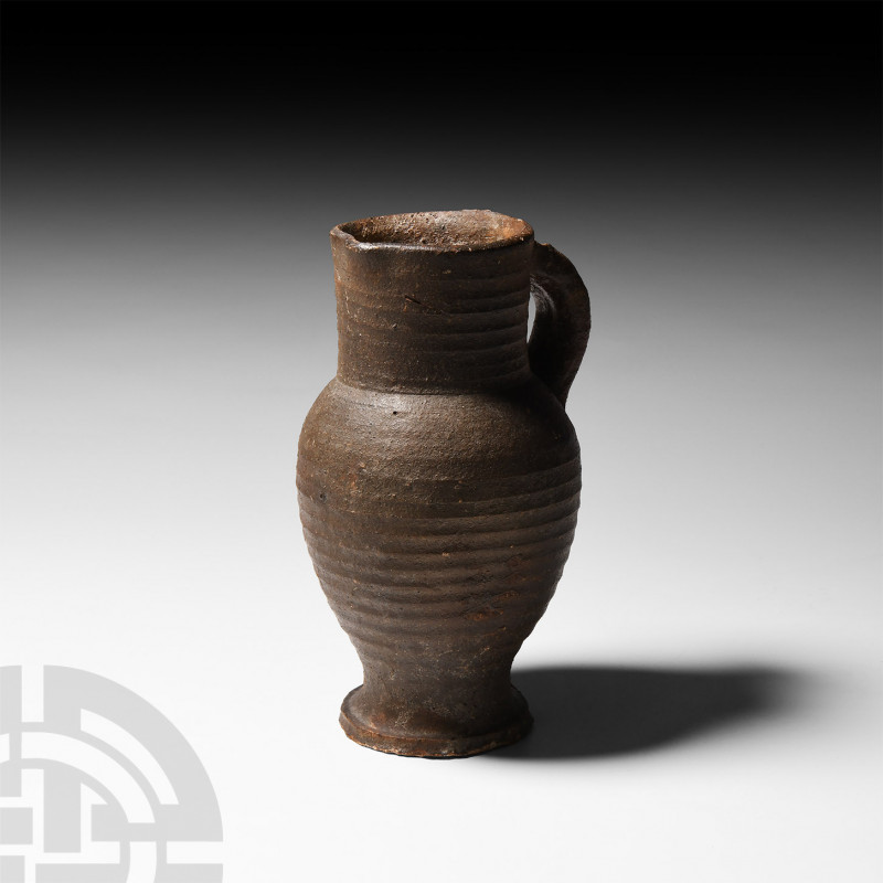 Medieval Stoneware Handled Flask 15th century A.D. A piriform stoneware flask wi...