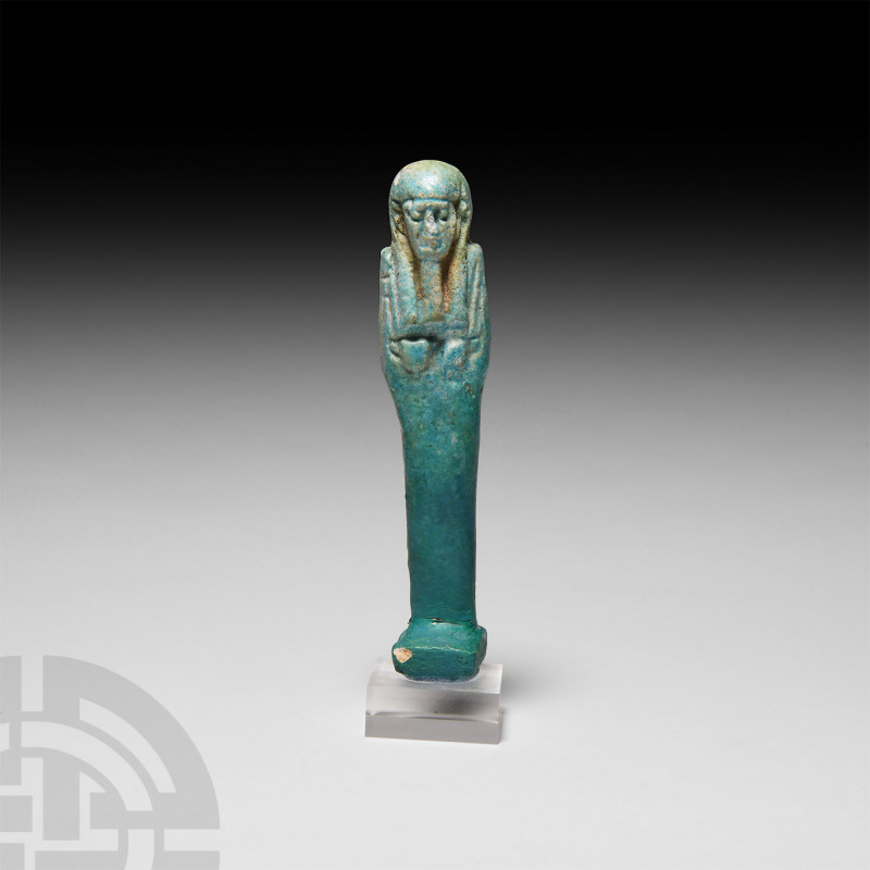 Egyptian Blue Glazed Shabti Late Period, 664-332 B.C. A blue-glazed mummiform sh...