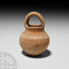 Greek Cypriot Handled Pot 2500-1900 B.C. A bulbous ceramic pot with everted neck, lentoid-section handle and remains of decorative pigmentation. 119 g...