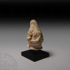 Etruscan Ram-Head Finial 6th-5th century B.C. A carved terracotta (argilla rosata) finial formed as a ram's head with spiral horns; mounted on a custo...