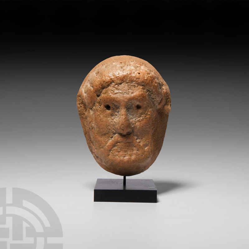 Graeco-Roman Terracotta Mask 4th-1st century B.C. A terracotta mask formed in th...