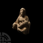 Late Hellenistic Terracotta Mother and Child Plaque Circa 1st century B.C. A terracotta statuette showing an infant suckling at its mother's breast, t...