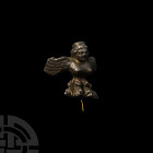 Greek Silver Harpy Fitting 5th-3rd century B.C. A silver fitting formed as a bare-chested harpy with wings spread, a four-toed, feathered foot below; ...