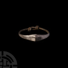 Parthian Silver Child's Bracelet 3rd century B.C.-2nd century A.D. A silver child's bracelet composed of a round-section hoop with coiled wire closure...