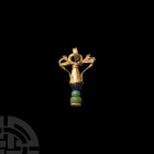 Greek Gold Amphora-Shaped Pendant 5th-3rd century B.C. A sheet-gold pendant composed of an inverted conical upper body with ear-shaped handles and cen...