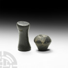 Etruscan Spindle Whorl and Spool Circa 5th-3rd century B.C. A pair of ceramic weaving implements comprising: a spindle whorl of fine-textured impasto ...