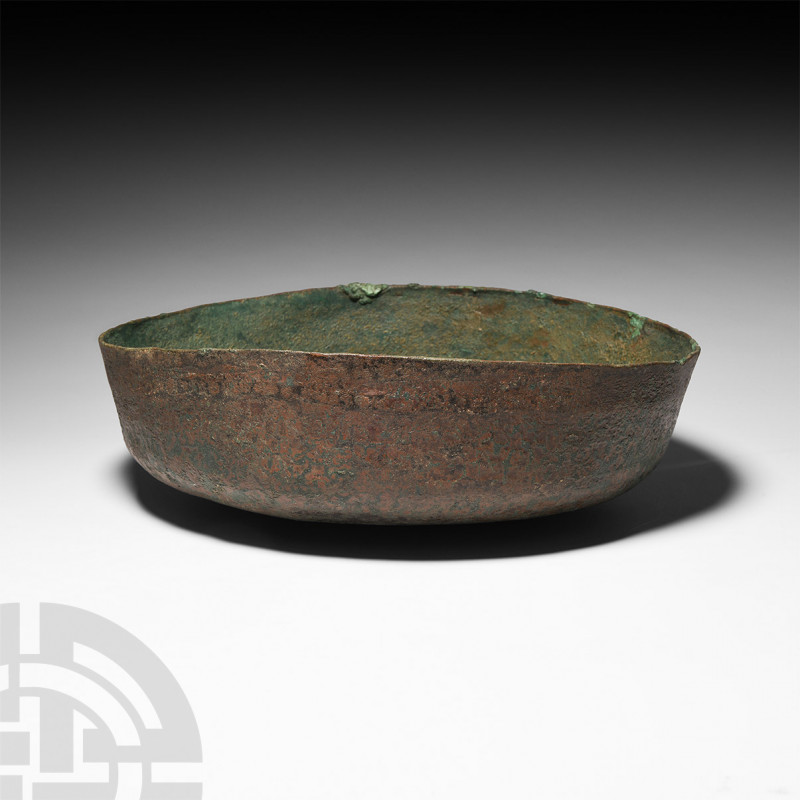 Etruscan Bronze Bowl 6th-5th century B.C. A deep bronze bowl composed of a squat...