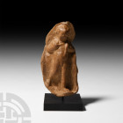 Hellenistic Terracotta Figure of a Running Boy 3rd-1st century B.C. A terracotta plaque showing a boy running nude in high-relief; mounted on a custom...