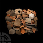 A Large Quantity of Roman Pottery Sherds Circa 1st-4th century A.D. A mixed group of pot sherds from various vessel types including rims and decorated...