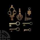 Roman and Later Key Group Circa 3rd-20th century A.D. A mixed group of keys and key elements, including a large Roman key handle, casket keys and watc...