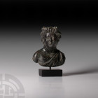 Roman Bust of Bacchus 2nd-3rd century A.D. A bronze bust of the god Bacchus (Greek Dionysus,) the head modelled in the round turned slightly to his ri...
