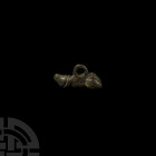 Roman Phallic Pendant 2nd-3rd century A.D. A phallic pendant with semi-naturalistic anatomical detailing, integral suspension loop. 6.64 grams, 24 mm ...
