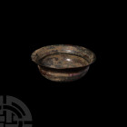 Roman Cup with Flared Rim 5th century A.D. A bronze cup with squat, carinated bowl, everted rim and rounded base. 224 grams, 13.5 cm wide (5 3/8 in.)....