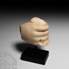 Roman Marble Hand Section 1st century B.C.-2nd century A.D. A marble right hand carved in a gripping posture, enigmatic object clasped between the pal...