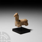 Romano-Parthian Glazed Terracotta Animal 3rd century B.C.-2nd century A.D. A glazed stylised horse figure modelled in the round standing, head facing ...