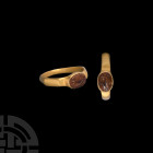Roman Cornucopia Gemstone in Gold Ring 3rd century A.D. A jasper gemstone with incised cornucopia in later gold ring with polygonal hoop. Cf. Ruseva-S...
