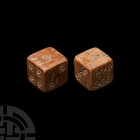 Roman Bone Dice Pair 1st-3rd century A.D. A pair of bone dice, each with ring-and-dot numerals and configured 1:6; 2:5; 3:4. 6.4 grams total, 11-12 mm...