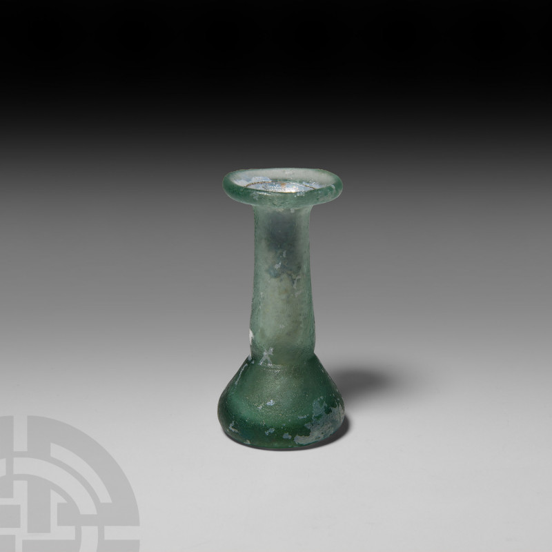 Roman Green Glass Vessel 1st-3rd century A.D. A green glass unguentarium with wi...