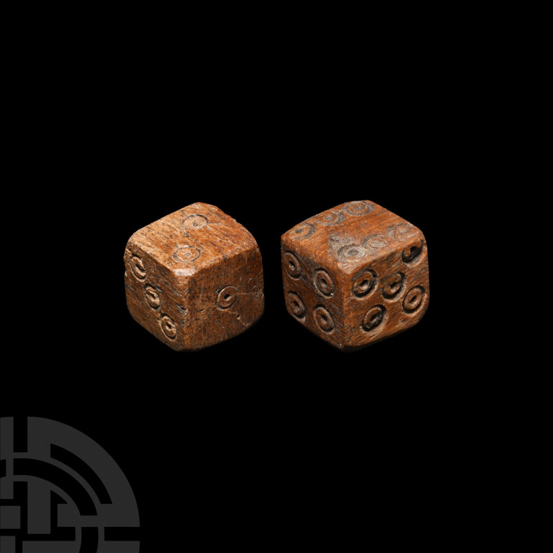 Roman Bone Dice Pair 1st-3rd century A.D. A pair of bone dice with ring-and-dot ...