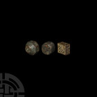 Byzantine Period Trade Weight Collection Circa 8th-12th century A.D. A mixed group of bronze trade weights comprising: one cuboidal with geometric mot...
