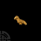 Byzantine Gold Bird Bead 6th-9th century A.D. A hollow-formed gold pendant of a perching bird, pierced to accept the string. 0.88 grams, 17 mm (5/8 in...