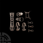 Byzantine Silver Belt Fitting Group Circa 7th century A.D. A mixed group of silver belt fittings comprising: three discoid studs with decoratively not...