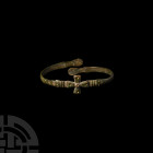 Byzantine Bracelet with Cross 9th-12th century A.D. A slender bracelet with D-section hoop and overlapping terminals, central cross with the five woun...