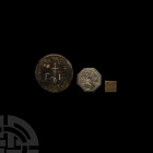 Byzantine and Other Trade Weight Group 8th-12th century A.D. A group of three copper-alloy trade weights comprising: a cuboidal weight bearing pricked...