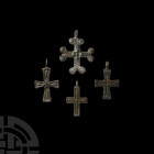 Byzantine Cross Pendant Collection Circa 11th-13th century A.D. A group of four cruciform pendants with engraved decoration; three with integral suspe...