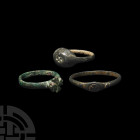 Byzantine Expanding Cross Ring Group 6th-7th century A.D. A group of three rings comprising: a large ring with expanded bezel, decorated with an expan...