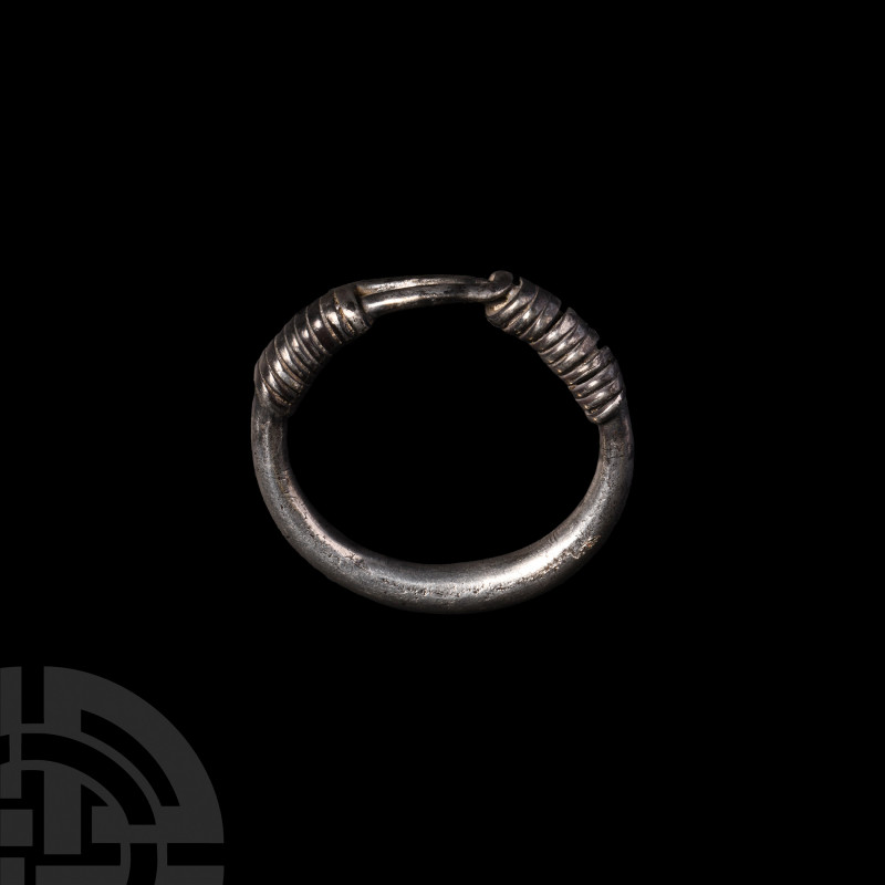 Western Asiatic Silver Bracelet 1st millennium B.C. A heavy silver bracelet comp...