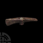 Western Asiatic Adze-Axe Late 2nd-early 1st millennium B.C. A copper-alloy adze-axe head composed of an off-centre cylindrical socket, one blade at a ...