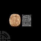 Judaean Bone Stamp Seal Iron Age II, 8th century B.C. A plano-convex bone stamp seal bearing an incuse human figure with raised arm blessing a 'neb-ba...