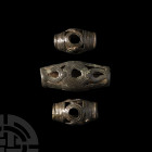 Amlash Cage Bead Collection 2nd-1st millennium B.C. A group of three bronze cage beads, each composed of a biconical body featuring openwork geometric...