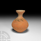 Western Asiatic Decorated Vase 1st millennium B.C. A ceramic vessel with biconvex body, funicular neck and footed base; circumferential foliate motif ...