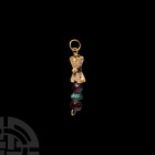 Western Asiatic Gold and Gemstone Pendant Early 1st millennium A.D. A pendant comprising a hollow-formed sheet gold saltire with granulation and pelle...