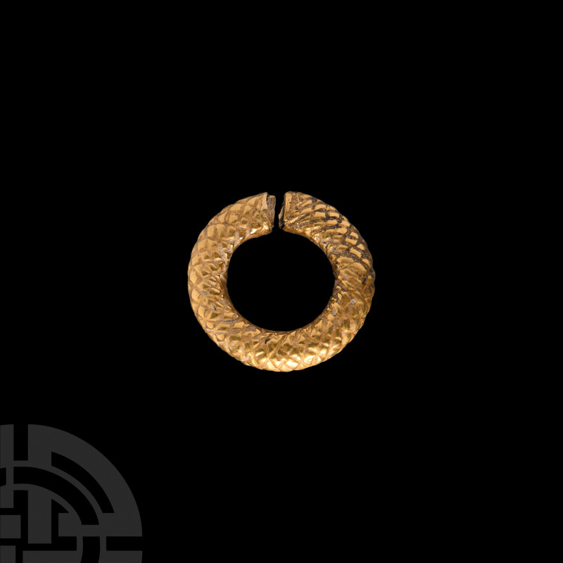 Achaemenid Gold Hair Ring 6th-4th century B.C. A sheet-gold, round-section penan...