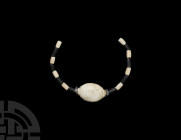 Necklace String 1st millennium B.C. A group of black and white jasper cylindrical beads with irregular quartz discs and a large oval-shaped white jasp...